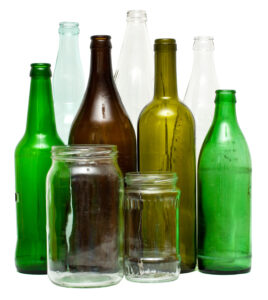 A variety of glass bottles and jars, isolated on white.